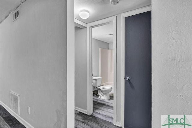12510 White Bluff Rd Unit 1406, Savannah, GA 31419 - corridor featuring visible vents, baseboards, and dark wood finished floors