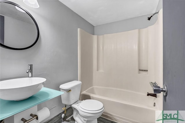 12510 White Bluff Rd Unit 1406, Savannah, GA 31419 - bathroom featuring toilet, a sink, and shower / washtub combination