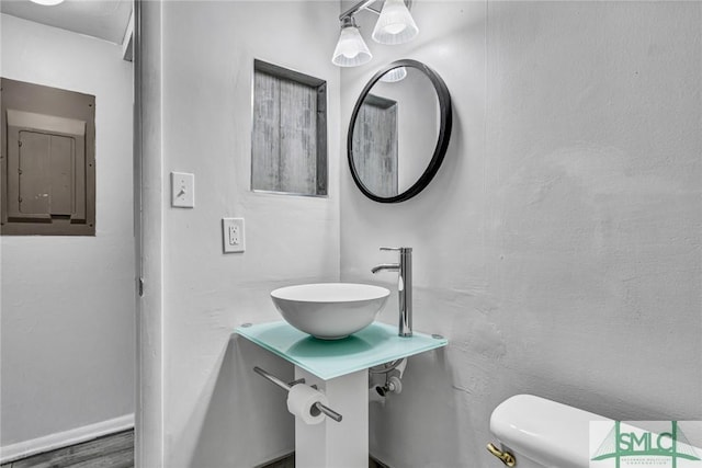 12510 White Bluff Rd Unit 1406, Savannah, GA 31419 - bathroom with electric panel, baseboards, a sink, and toilet