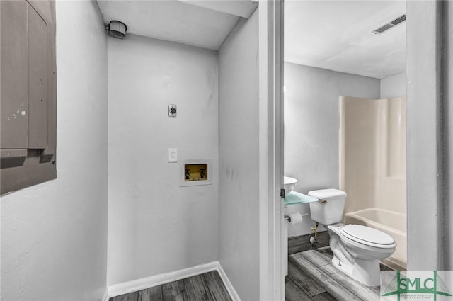 12510 White Bluff Rd Unit 1406, Savannah, GA 31419 - full bath with visible vents, baseboards, electric panel, toilet, and wood finished floors