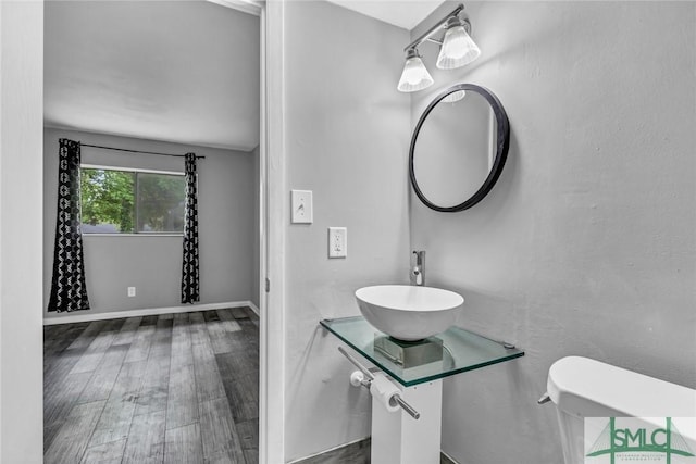 12510 White Bluff Rd Unit 1406, Savannah, GA 31419 - half bathroom with a sink and wood finished floors
