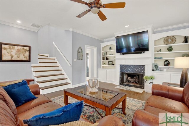 5 Wigmore Cir, Savannah, GA 31410 - living room featuring visible vents, a ceiling fan, crown molding, stairway, and wood finished floors