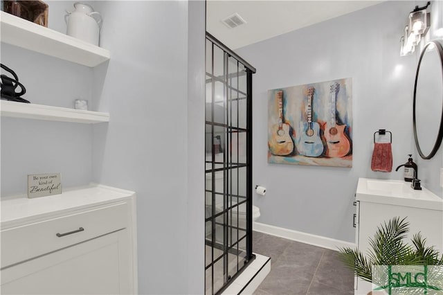 5 Wigmore Cir, Savannah, GA 31410 - bathroom with visible vents, baseboards, a walk in shower, vanity, and tile patterned flooring