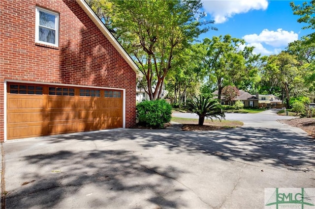5 Wigmore Cir, Savannah, GA 31410 - view of side of property with brick siding and concrete driveway
