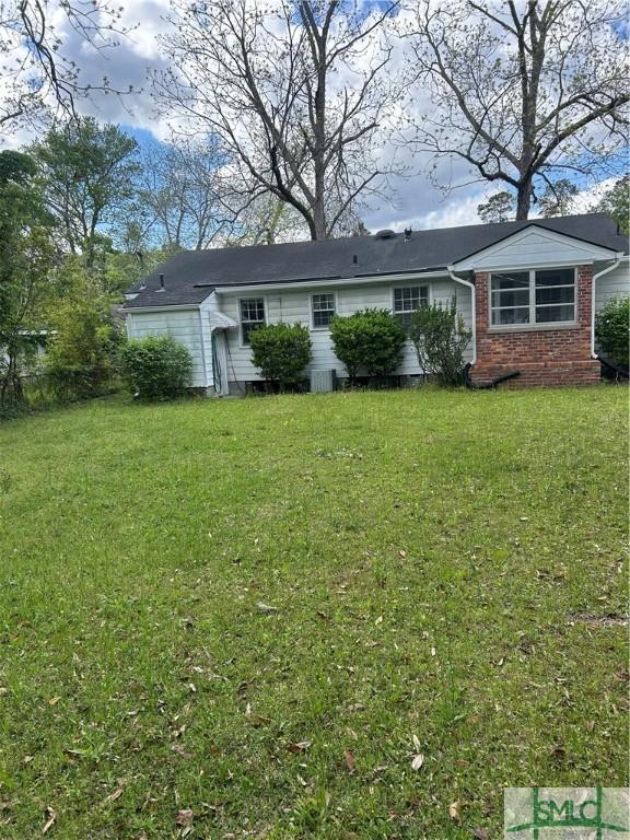 30 Lawton Ave, Savannah, GA 31404 - view of front of property featuring a front yard and brick siding
