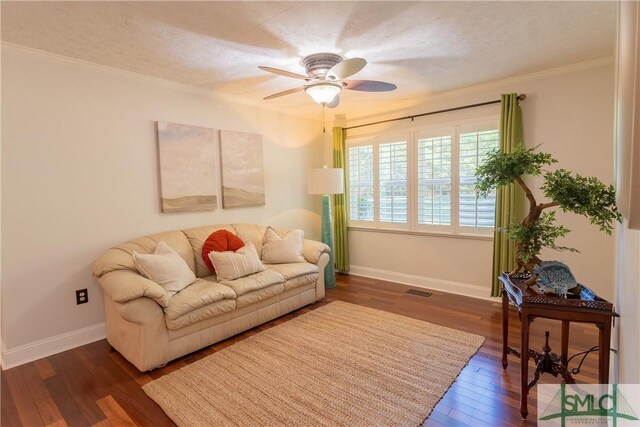 3411 Ponderosa Rd, Portal, GA 30450 - living area with baseboards, dark wood-style floors, a ceiling fan, crown molding, and visible vents