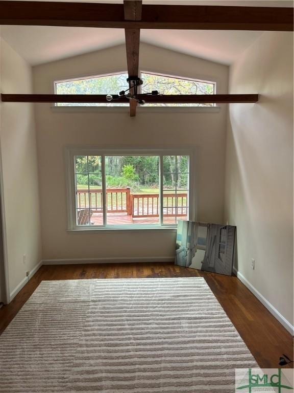 3411 Ponderosa Rd, Portal, GA 30450 - unfurnished living room with beamed ceiling, a wealth of natural light, wood finished floors, and baseboards