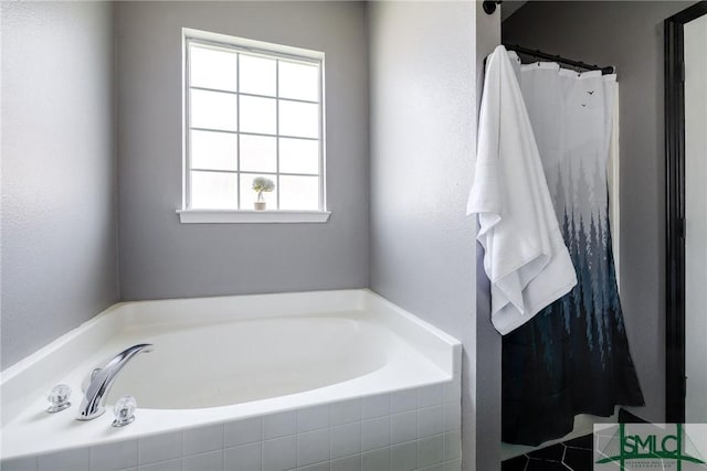 bathroom featuring a shower with curtain and a garden tub