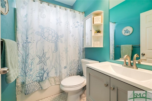 full bathroom featuring toilet, shower / bath combo, vanity, and tile patterned flooring