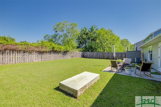 view of yard with a patio area and a fenced backyard