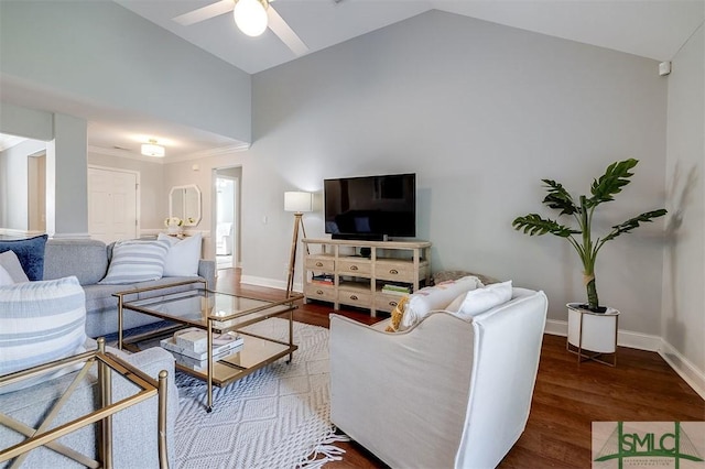 living room with ceiling fan, baseboards, vaulted ceiling, and wood finished floors