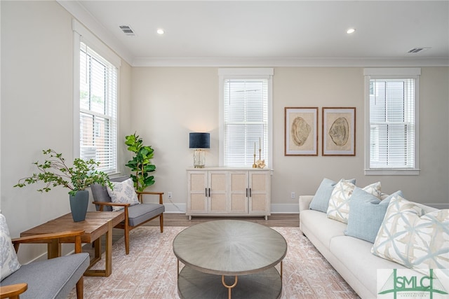 living room with visible vents, light wood-type flooring, and recessed lighting