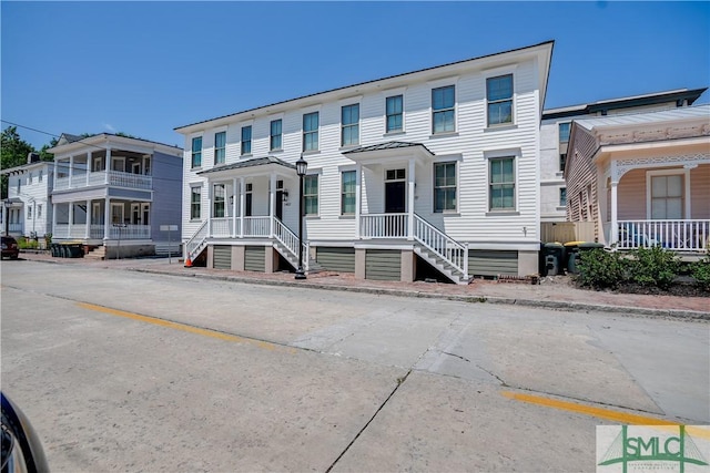 view of property featuring covered porch