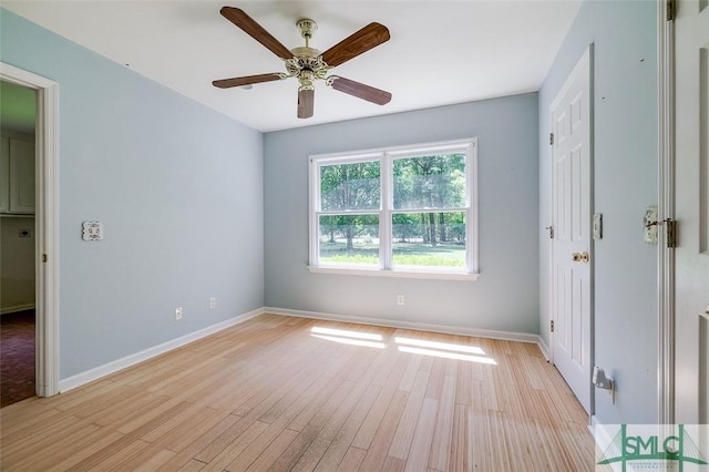 unfurnished bedroom with light wood-style floors, baseboards, and a ceiling fan