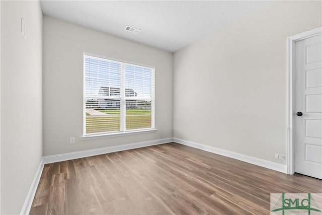 314 Providence Trce, Statesboro, GA 30461 - unfurnished room featuring visible vents, baseboards, and wood finished floors