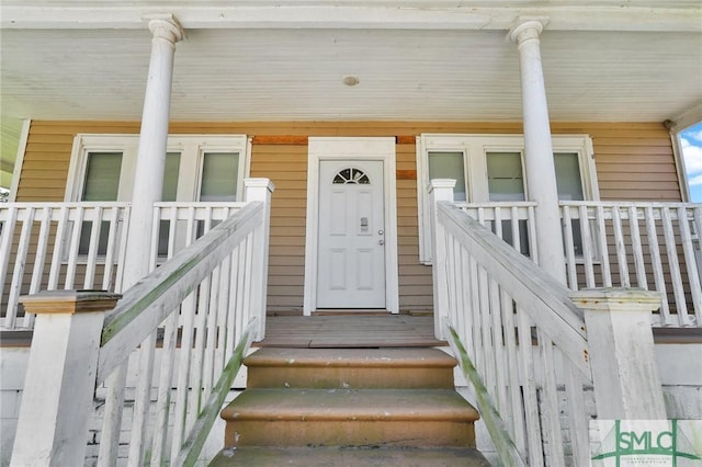 doorway to property with a porch