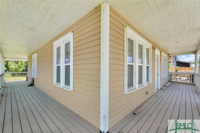 wooden terrace featuring a porch