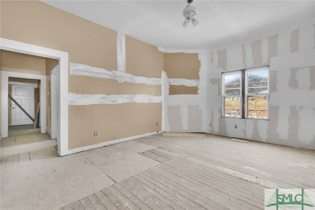 empty room featuring wood finished floors