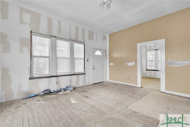 entrance foyer featuring wood finished floors and a ceiling fan
