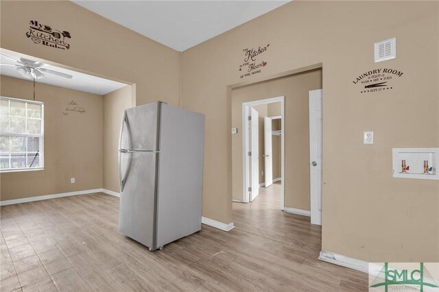 633 W 39th St, Savannah, GA 31415 - kitchen featuring visible vents, freestanding refrigerator, a ceiling fan, and light wood-style flooring