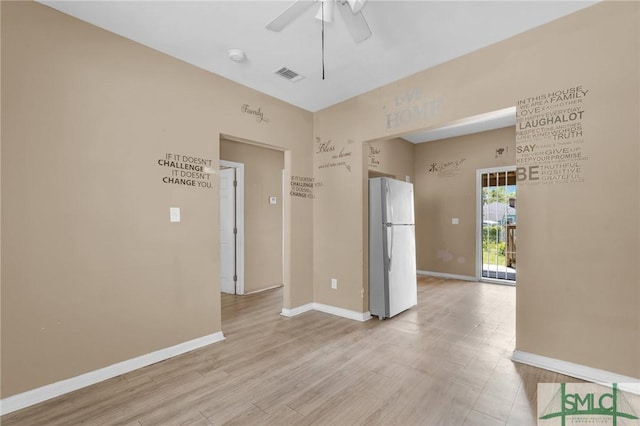 633 W 39th St, Savannah, GA 31415 - spare room featuring visible vents, light wood-type flooring, a ceiling fan, and baseboards