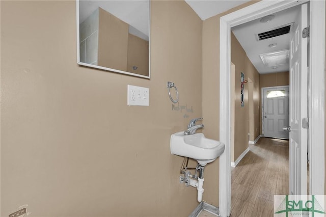 633 W 39th St, Savannah, GA 31415 - hall with visible vents, baseboards, attic access, and wood finished floors