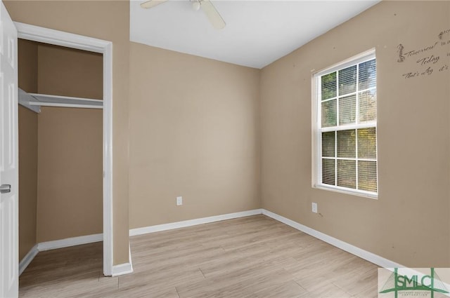 633 W 39th St, Savannah, GA 31415 - unfurnished bedroom featuring light wood-style flooring, baseboards, and a ceiling fan