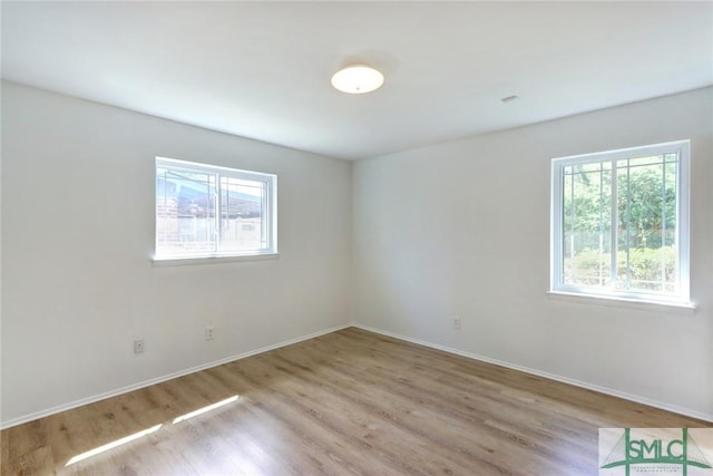 12445 Deerfield Rd, Savannah, GA 31419 - unfurnished room featuring wood finished floors, baseboards, and plenty of natural light