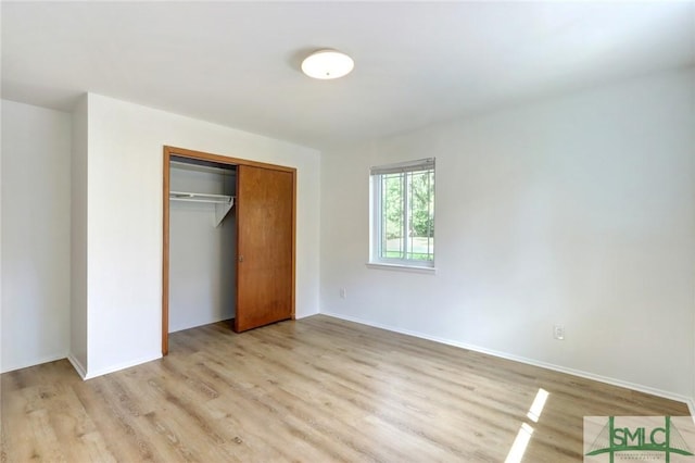 12445 Deerfield Rd, Savannah, GA 31419 - unfurnished bedroom with light wood finished floors, a closet, and baseboards