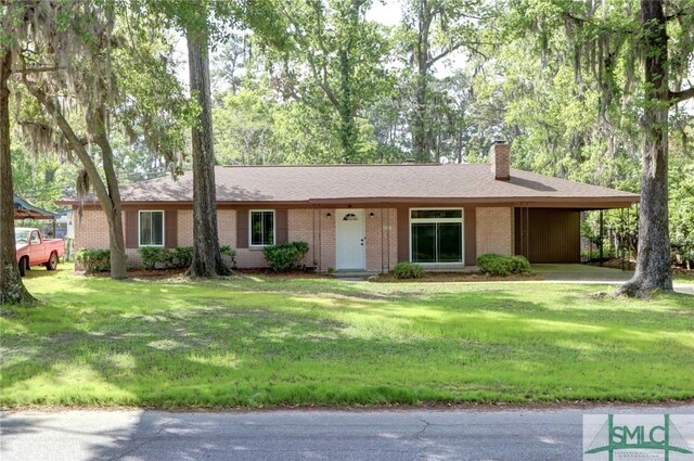 12445 Deerfield Rd, Savannah, GA 31419 - single story home with an attached carport, a front yard, brick siding, and a chimney