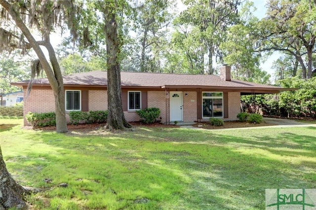 12445 Deerfield Rd, Savannah, GA 31419 - ranch-style house with a chimney, a front yard, and brick siding