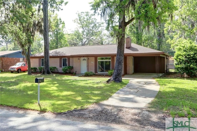 12445 Deerfield Rd, Savannah, GA 31419 - single story home featuring a front yard, brick siding, a chimney, concrete driveway, and an attached carport