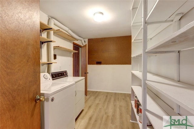 12445 Deerfield Rd, Savannah, GA 31419 - laundry area with washer and clothes dryer, light wood-style floors, and laundry area