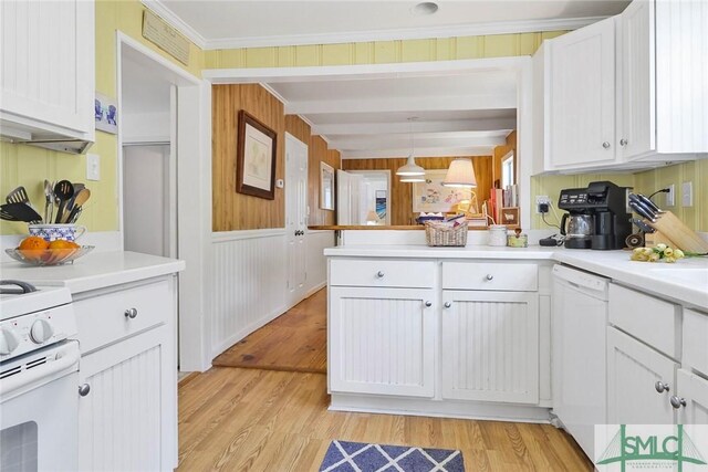 712 2nd Ave, Tybee Island, GA 31328 - kitchen featuring white appliances, a peninsula, white cabinets, and visible vents
