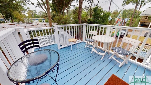 712 2nd Ave, Tybee Island, GA 31328 - wooden deck with outdoor dining space