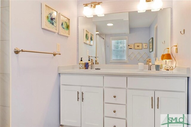 712 2nd Ave, Tybee Island, GA 31328 - bathroom featuring double vanity, a sink, and curtained shower