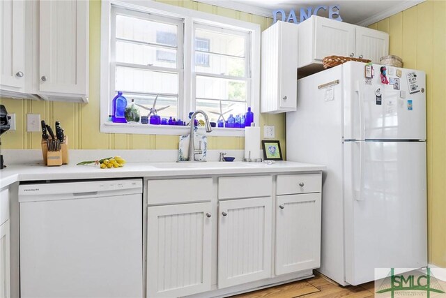 712 2nd Ave, Tybee Island, GA 31328 - kitchen featuring a sink, white cabinets, and white appliances