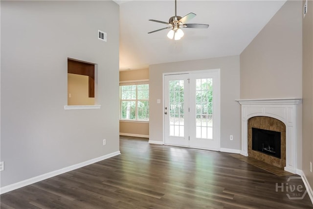 111 Tappan Zee Dr, Pooler, GA 31322 - unfurnished living room featuring a ceiling fan, dark wood-style floors, a tile fireplace, baseboards, and high vaulted ceiling
