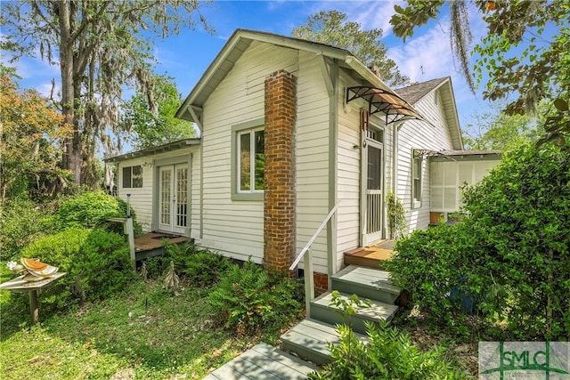 103 Church St, Bloomingdale, GA 31302 - view of side of property featuring french doors and a wooden deck