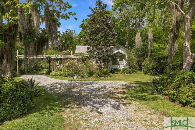 103 Church St, Bloomingdale, GA 31302 - view of yard featuring driveway