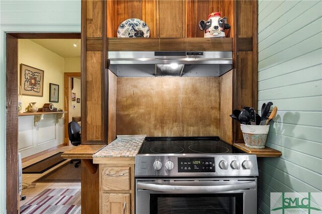 103 Church St, Bloomingdale, GA 31302 - kitchen featuring stainless steel electric range, extractor fan, and light countertops