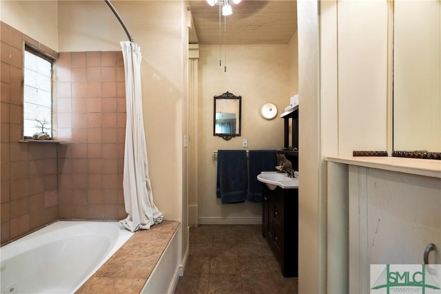 103 Church St, Bloomingdale, GA 31302 - bathroom with shower / tub combo, vanity, baseboards, and tile patterned flooring