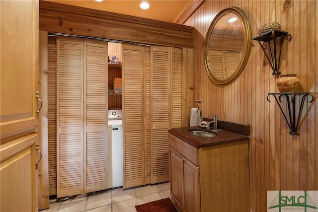 103 Church St, Bloomingdale, GA 31302 - bathroom with a closet, wooden walls, tile patterned flooring, and vanity