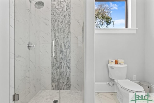 full bath featuring toilet, marble finish floor, and a marble finish shower