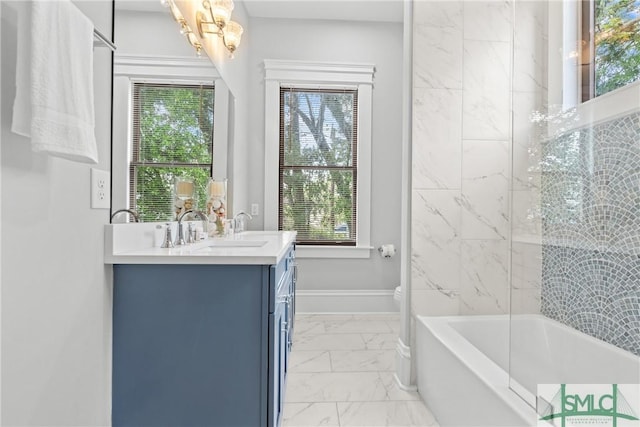 full bathroom with toilet, marble finish floor, and vanity