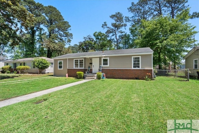 ranch-style home with a front yard, fence, and brick siding