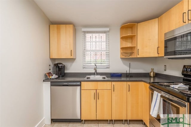 kitchen with light brown cabinets, dark countertops, open shelves, a sink, and stainless steel appliances