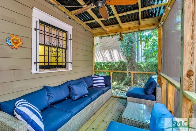 sunroom / solarium with outdoor lounge area, ceiling fan, and a healthy amount of sunlight
