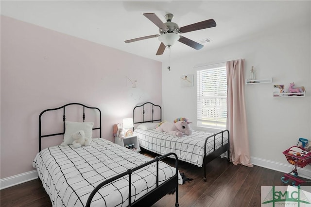 bedroom with baseboards, ceiling fan, and wood finished floors