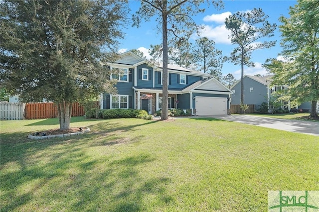 view of front of home featuring a front lawn, concrete driveway, and fence